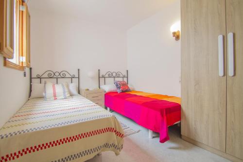 Giường trong phòng chung tại Casa Nord 50 by Mallorca House Rent