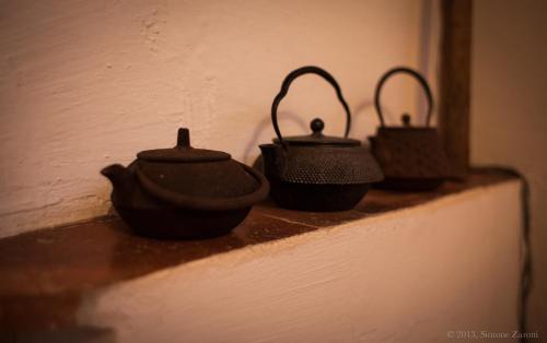 a group of three pots sitting on a wall at Piazza San Pantaleo in Sorso