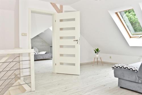 Posteľ alebo postele v izbe v ubytovaní Apartament w Chmurach - Apartamentuj