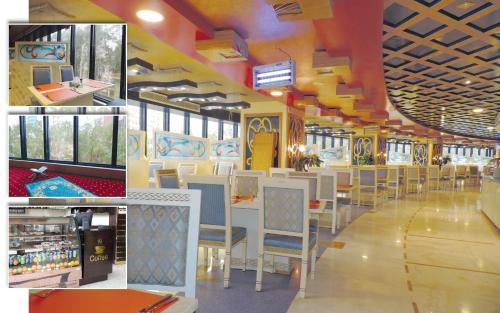 a train station with tables and chairs and windows at Montana Al Azizia Hotel in Makkah