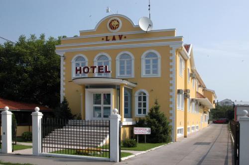 a hotel building with a sign on it at Garni Hotel Lav in Belgrade