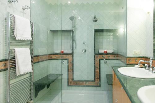 a bathroom with a shower and a sink and a showerspective at La Dolce Vista - B&B di Charme in Manfredonia