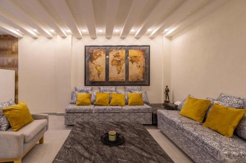a living room with couches and yellow pillows at Mexico Historic Center Modern Apartment in Mexico City