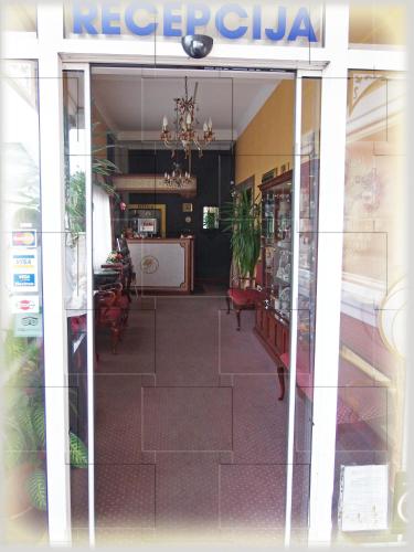 a view of a restaurant from the window of a store at Garni Hotel Lav in Belgrade