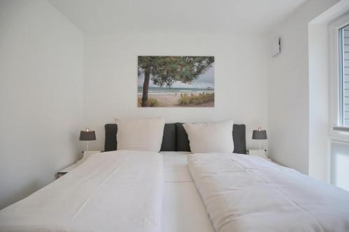 Postelja oz. postelje v sobi nastanitve Haus Ostseedüne Haus Ostseedüne Appartement 7