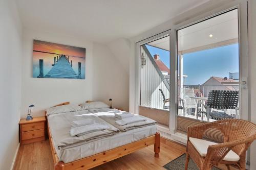 Ένα ή περισσότερα κρεβάτια σε δωμάτιο στο Seebrücke Seebrücke Appartement 26