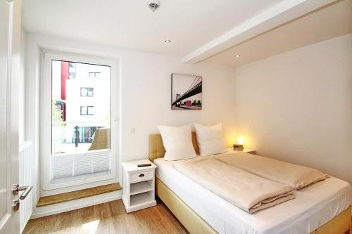 Postel nebo postele na pokoji v ubytování Residenz am Timmendorfer Platz Residenz am Timmendorfer Platz Appartement 3