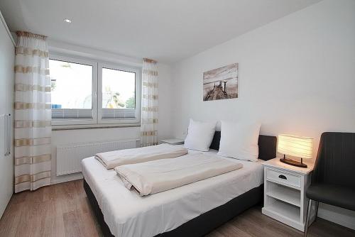 Postel nebo postele na pokoji v ubytování Residenz am Timmendorfer Platz Residenz am Timmendorfer Platz Appartement 1