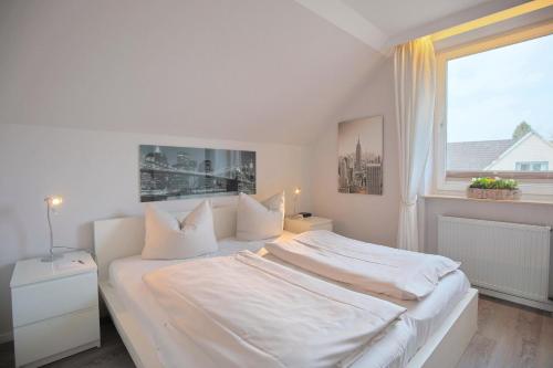 Postel nebo postele na pokoji v ubytování Doppelhaushälfte Am Knurrhahn Am Knurrhahn Appartement 2
