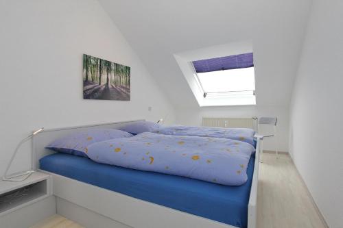 Ένα ή περισσότερα κρεβάτια σε δωμάτιο στο Residenz Ostseestrand Appartement 25