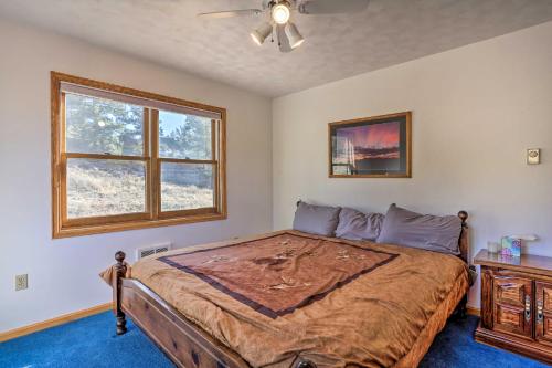 una camera da letto con un letto e una finestra di Remote WY Ranch with 170 Acres and Views Galore! a Glenrock