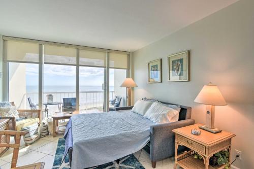 a bedroom with a bed and a view of the ocean at Heated Pool and Beach View Galveston Resort Condo! in Galveston