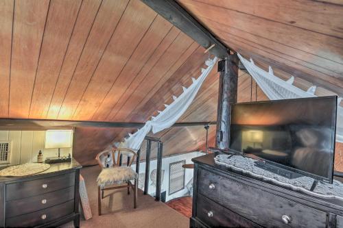 a room with a bedroom with a ceiling with wood at Walk to Shore: Cottage w/ Deck in Surfside Beach! in Freeport