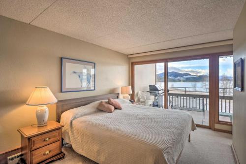 a bedroom with a bed and a balcony with a view at Less Than 15 Mi to Breck Dillon Condo with Fireplace in Dillon
