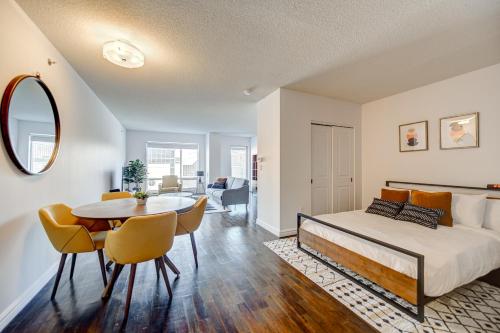a bedroom with a bed and a table and chairs at Le Mille Neuf Apartments Modern Comfort in Downtown Montreal in Montréal