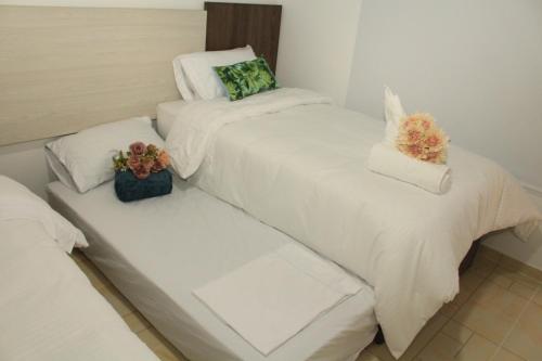 Cama o camas de una habitación en Hotel Celeste Inn Chinauta- Fusagasugá