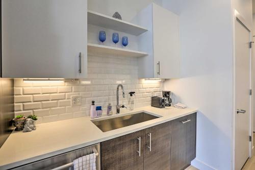a kitchen with a sink and a counter top at Stylish Denver Studio Less Than 1 Mile to Coors Field! in Denver