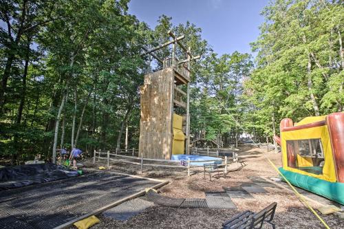 a playground with a slide and a play structure at Spacious Family Home with Deck at Massanutten Resort in McGaheysville