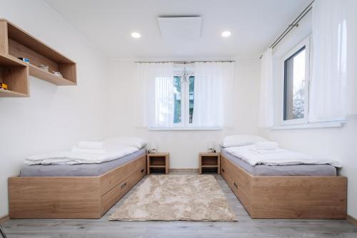 Postel nebo postele na pokoji v ubytování Apartmán Hugo Klínovec