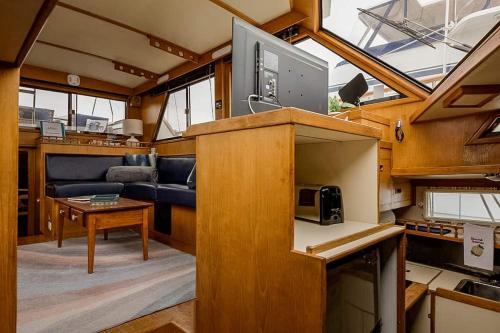 a view of a kitchen and living room in a boat at 2BR Spacious & Comfy 43' Yacht - Heat & AC - On the Freedom Trail - Best Nights Sleep in Boston