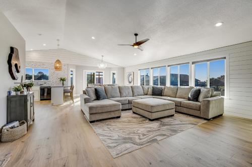 a large living room with a couch and a table at Sand Dollar Shore in Fort Bragg