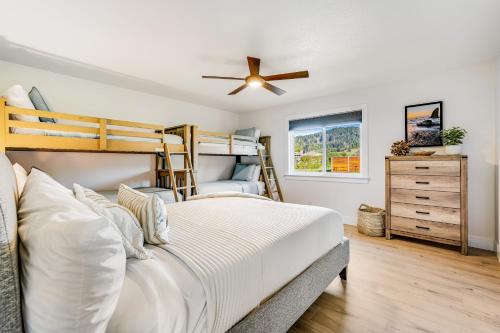 a bedroom with a bunk bed and a ceiling fan at Sand Dollar Shore in Fort Bragg