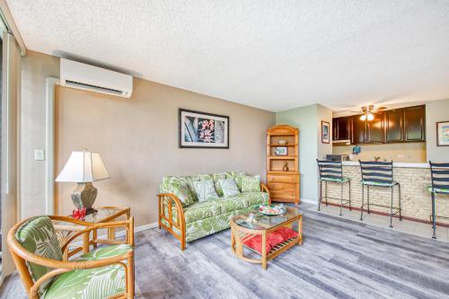 a living room with a couch and a table at Kalanikai #218 in Kailua-Kona