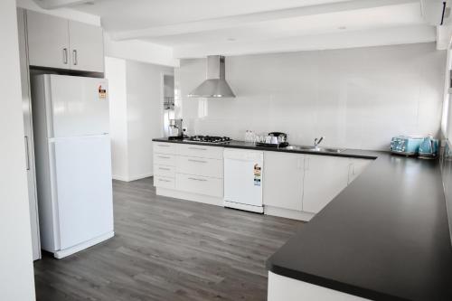 Η κουζίνα ή μικρή κουζίνα στο The Harrington Serviced Apartments