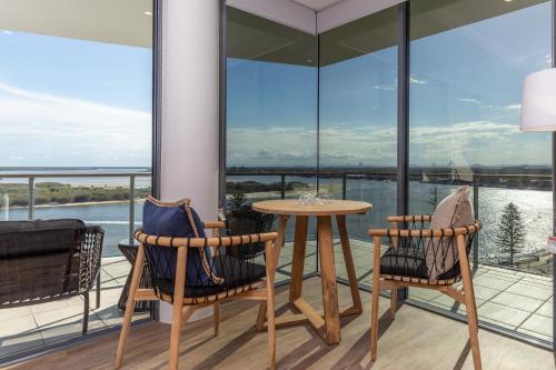 a balcony with a table and two chairs at The Waterford Prestige Apartments in Caloundra