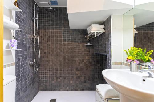 a bathroom with a sink and a shower at Marbella in Love in Marbella