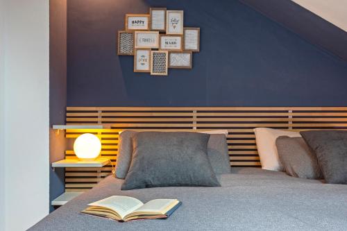 a bedroom with a bed with a book on it at Marbella in Love in Marbella