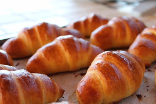 a group of croissants sitting on top of a table at Ecolodge Selvitelle - Sustainable Retreat Amidst Olive Groves in Cilento in Cicerale