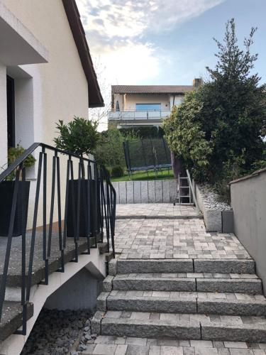 a set of stairs leading up to a house at Eigene Wohnung im Dreifamilienhaus EM2024 plus Ticket auf Anfrage Stadion Stuttgart in Oberstenfeld