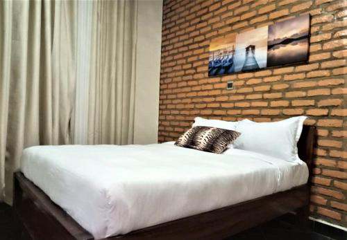 Ένα ή περισσότερα κρεβάτια σε δωμάτιο στο SUGIRA ECO-RESORT