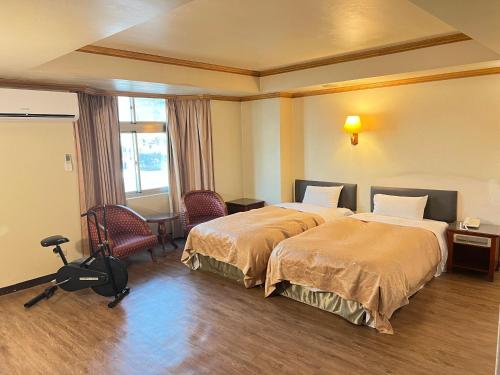 Кровать или кровати в номере San Ho Business Hotel