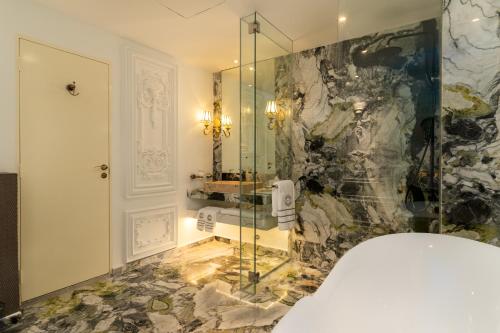 a bathroom with a shower and a sink at arte by Thomas Chan in Kuala Lumpur