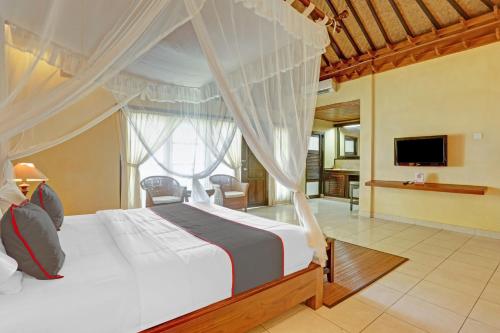 Giường trong phòng chung tại Collection O 90805 Aditya Beach Resort And Spa