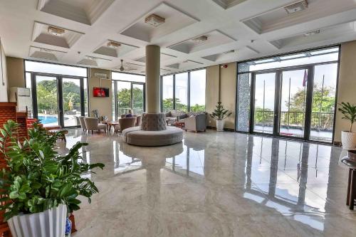 a lobby with a fountain in the middle of a building at KEP BAY HOTEL & RESORT in Kep