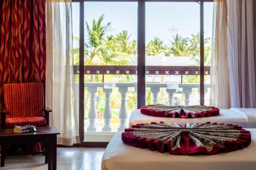 Ένα ή περισσότερα κρεβάτια σε δωμάτιο στο PrideInn Paradise Beach Resort & Spa Mombasa