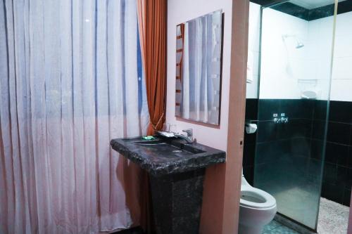 Vannituba majutusasutuses Helios Hotel Malang