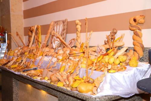 a table topped with lots of different types of food at The Three Corners Sunny Beach Resort in Hurghada