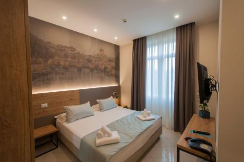 Villa Aurelia tesisinde bir odada yatak veya yataklar