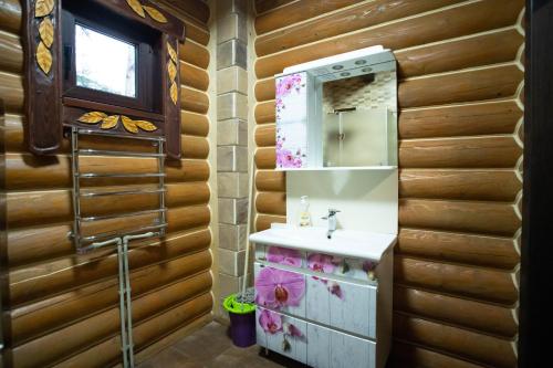 a bathroom with a sink and a mirror at Green Zone in Migovo