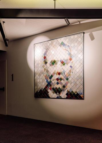 a large stained glass image of a woman on a wall at Hotel Hotel - Member of Design Hotels in Lisbon