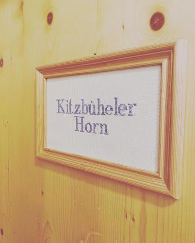 a picture frame on a wall with the words kithcliffe horn at Hof Oberhaus in Kitzbühel