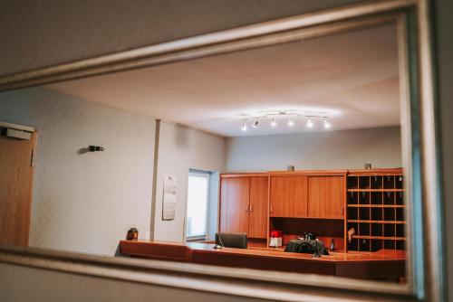 an empty room with a window and a desk with a laptop at Astheimer Schlösschen in Trebur