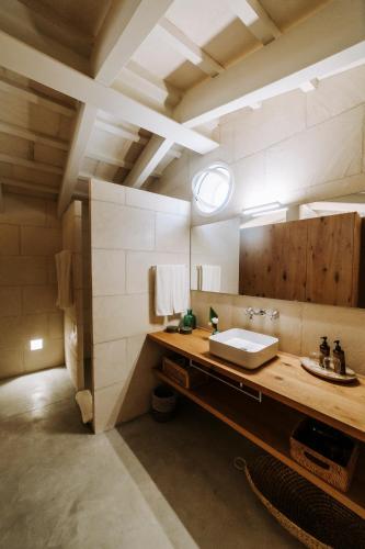 a bathroom with a sink and a mirror at Agroturismo Rafal Rubí in Alaior