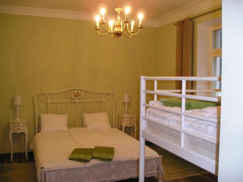 a bedroom with two bunk beds and a chandelier at Paslepa Mõis in Paslepa
