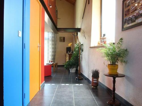 a hallway with potted plants in a room at Bergerie moderne au calme, nature luxuriante, proche du Lac de Malaguet - FR-1-582-20 in Céaux-dʼAllègre
