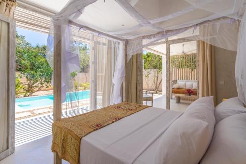 מיטה או מיטות בחדר ב-Saffron Villas